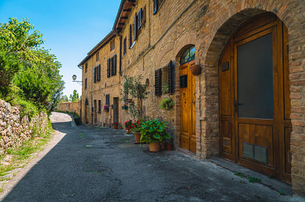 Brick houses and arranged street, an Architecture Photo by Alpine Dreams