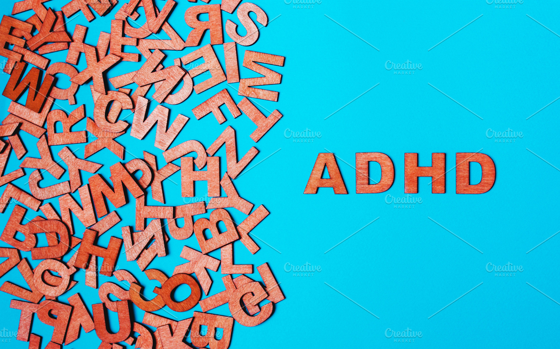Word adhd from wooden letters on a b containing adhd, deficit, and diagnosis, a School & Education Photo by KulT design