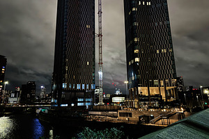 Night view of Manchester Salford skyscrapers under construction by the river, c, a Photo by AS photostudio