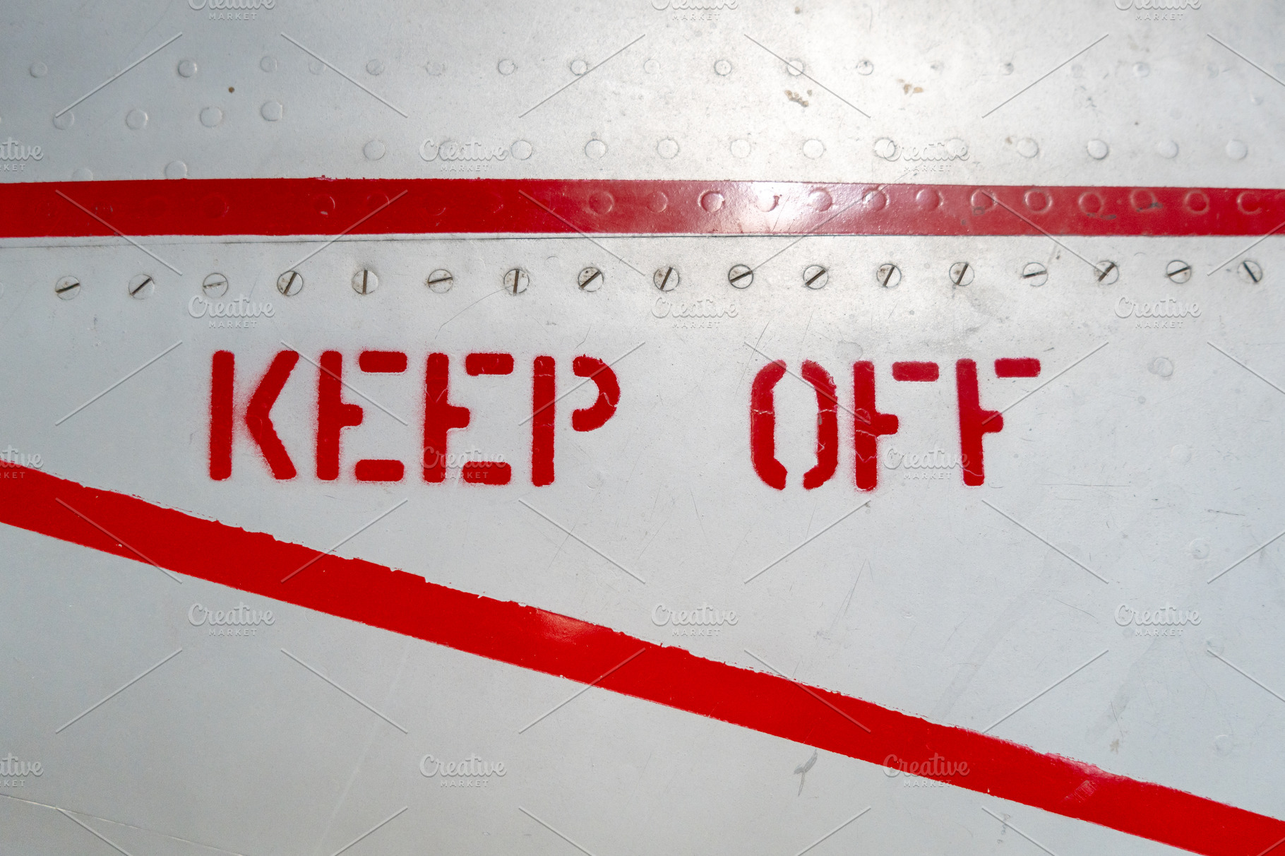 Keep Off warning sign on the fuselage of an old aircraft, a Transportation Photo by GoodGoods