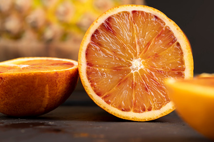 sliced orange with yellow-red juicy flesh, a Photo by MyPhotos