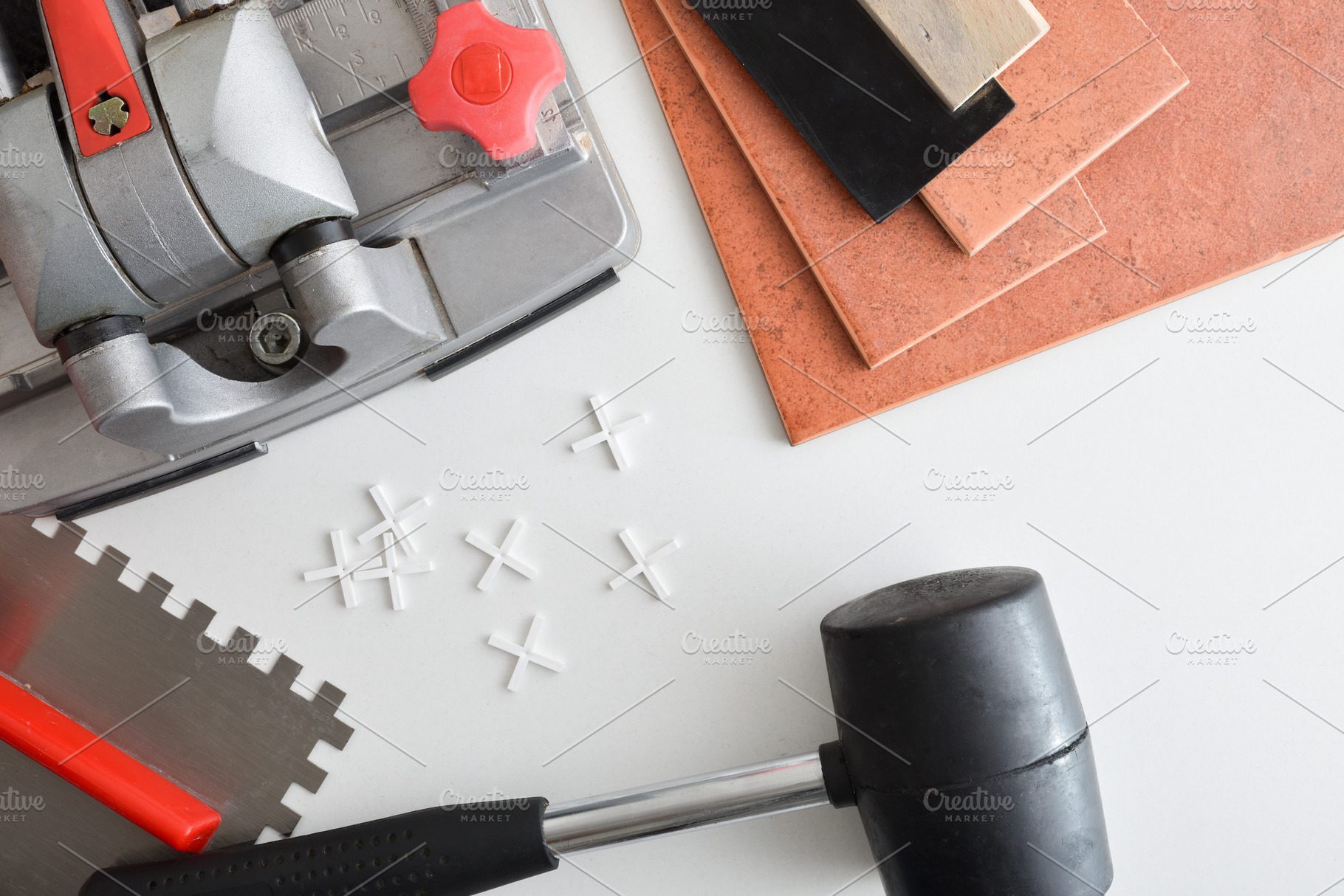 Detail of tile cutter on white table with tools, an Architecture Photo by Davizro's Market