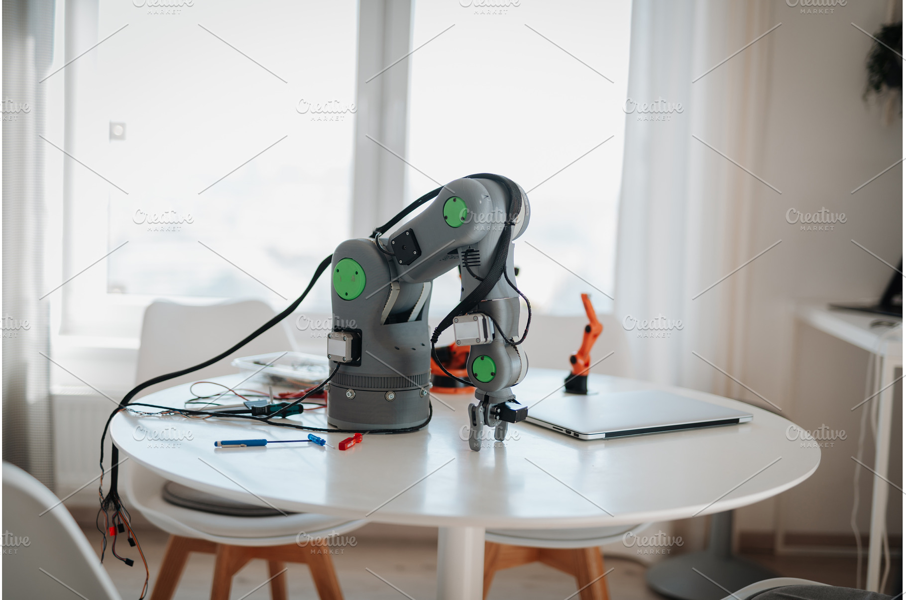 Robotic arm prototype on a table in, a Technology Photo by HalfPoint