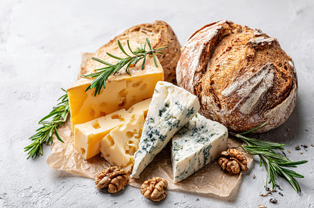 Enjoying brie and blue cheese with rosemary and walnuts beside fresh artisan br, a Food & Drink Photo by AlyaAnd