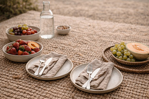 Outdoor picnic setup with fruit plat, a Photo by Dvoevnore photos