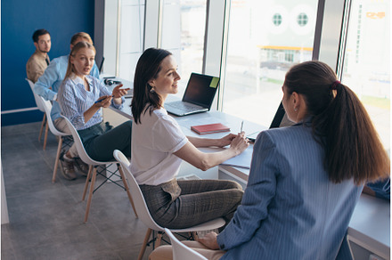 Group of colleagues sitting in a row, a Business Photo by undrey