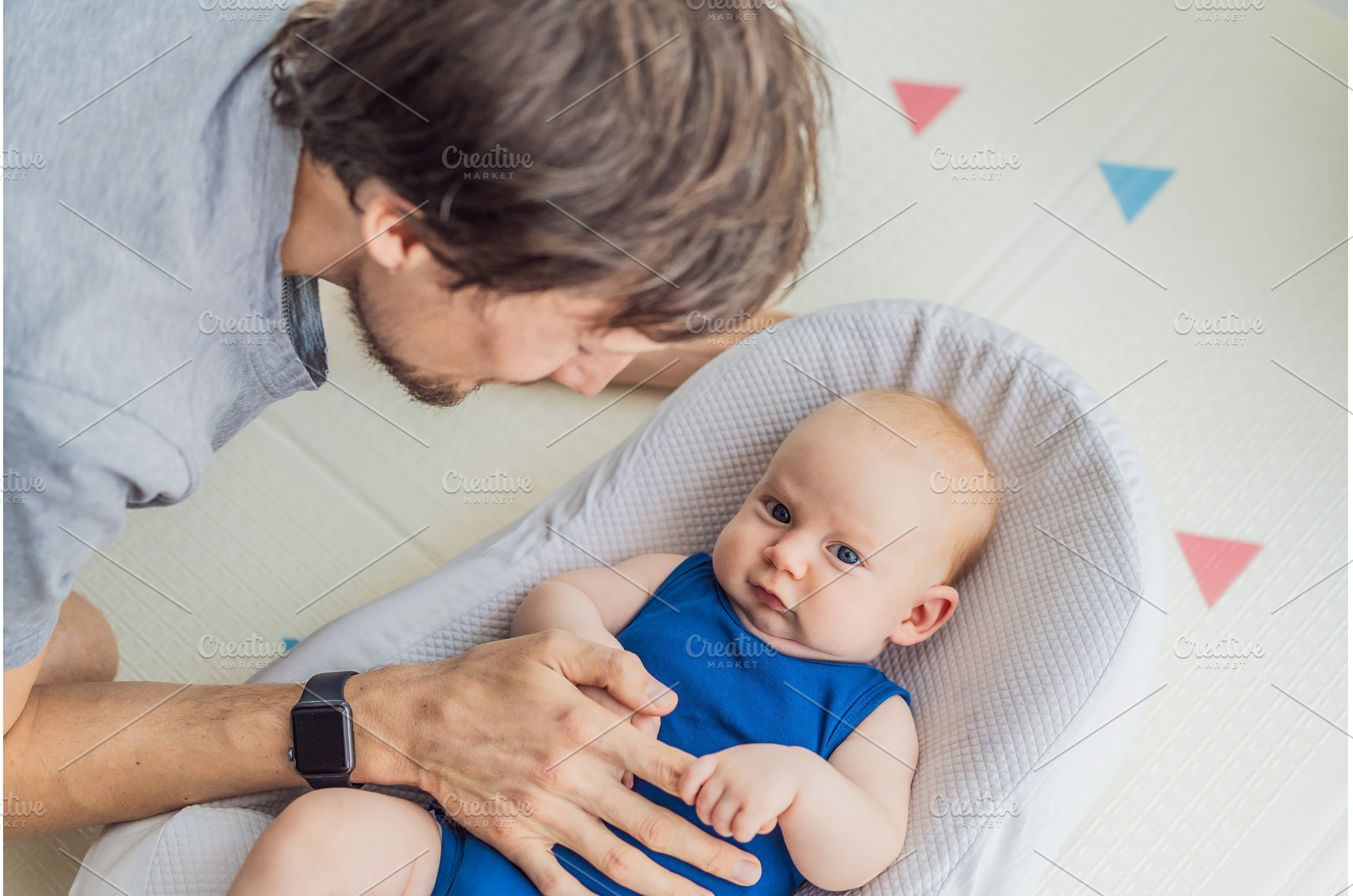 Loving father interacts with his 3, a Person Photo by Elizaveta Galitskaya