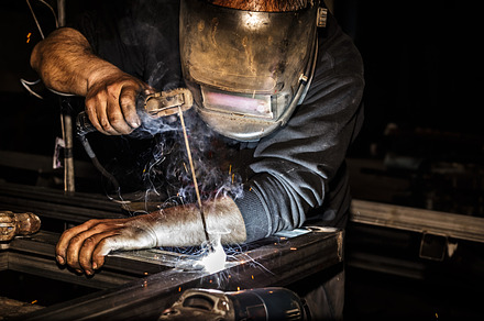 Welder in mask welds steel, an Industrial Photo by Shootdiem