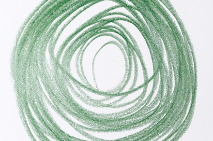 Hand drawn spiral with green pencil on white background. Spiral