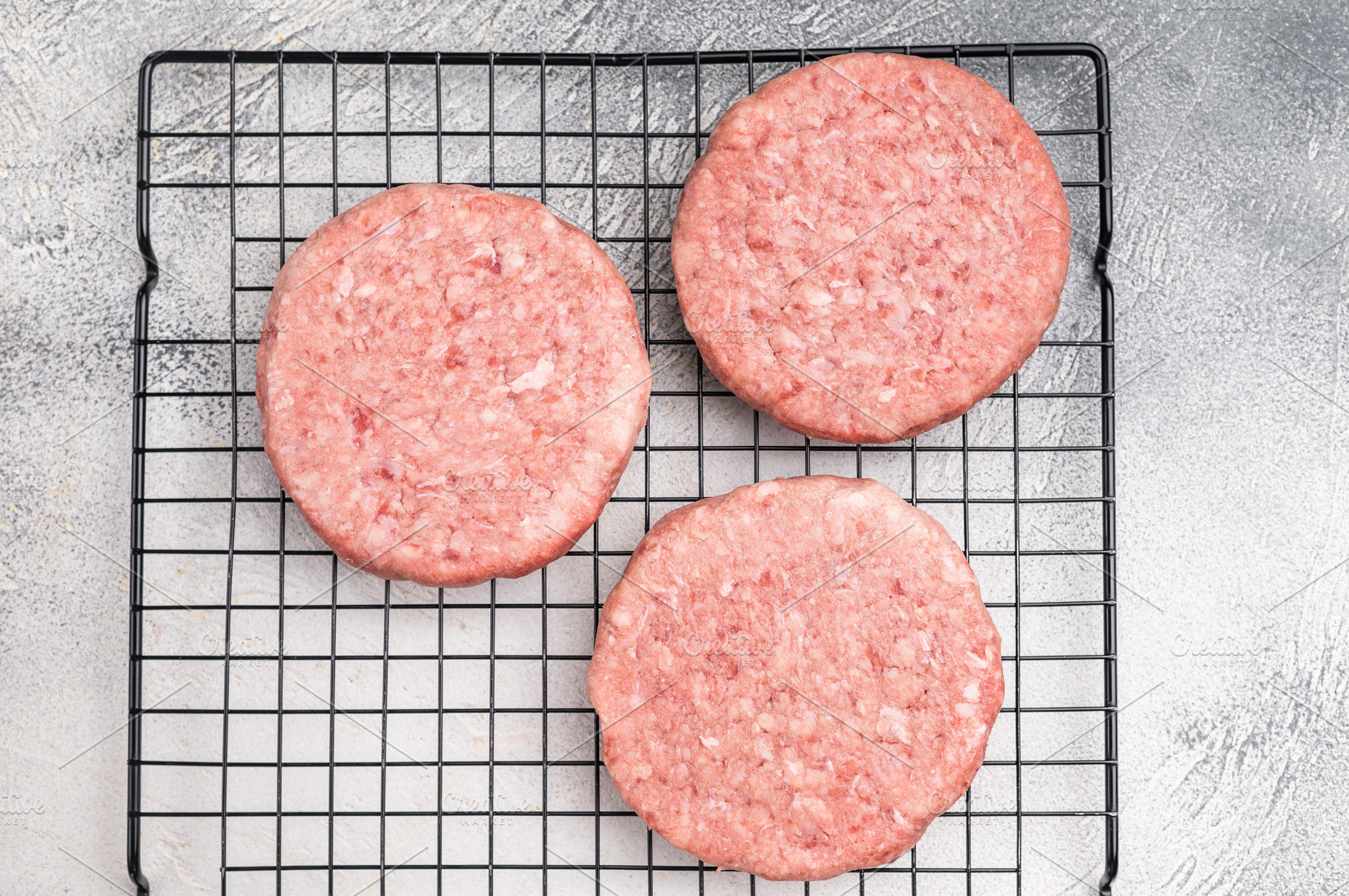 Close up of a juicy raw meat patty cutlet, ideal for crafting mo, a Food & Drink Photo by composter-box@mail.ru