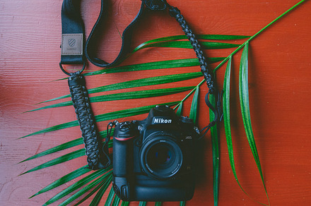 Camera containing camera, nikon, and camera strap