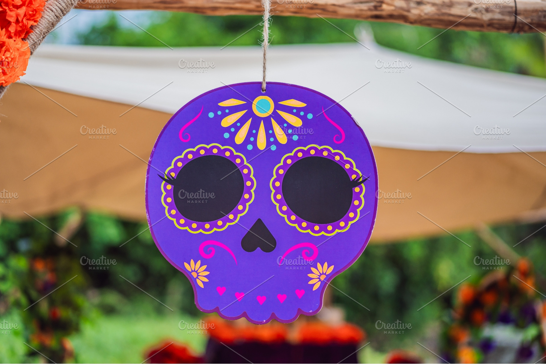 Colorful hanging skull decoration at, a Holiday Photo by Elizaveta Galitskaya