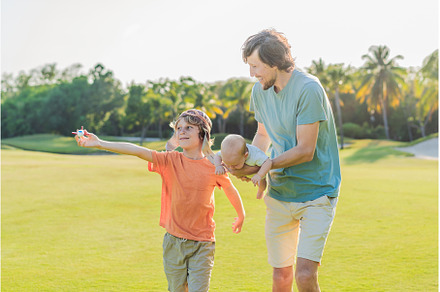 Father with his two sons in the park
