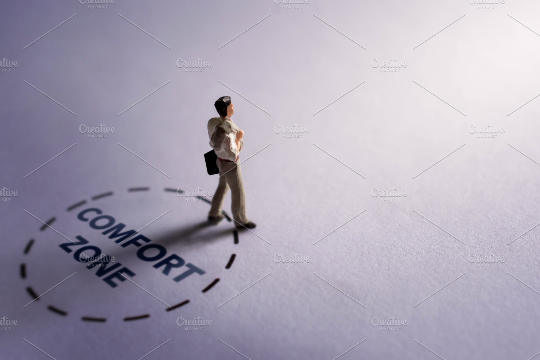 Businessman stepping out of comfort zone circle, personal growth, a Photo by salmon.black