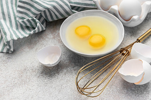 Preparing raw eggs for baking or a healthy breakfast, a Food & Drink Photo by Olena Rudo