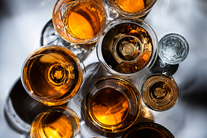 Strong drinks, spirits and distillates in glasses: cognac, grapp