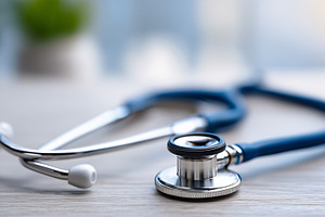 Close up of a stethoscope on a wood, a Health & Medical Photo by MistyDay