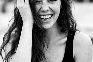 Freckled Young Woman Laughing B&W, a Person Photo by Virgo Studio