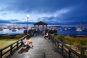 Wooden boardwalk and ships at background, punta del este city, u, a Person Photo by DanFLCreativo