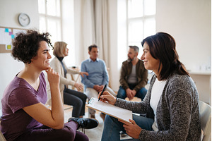 Woman talking with psychologist, a Person Photo by HalfPoint