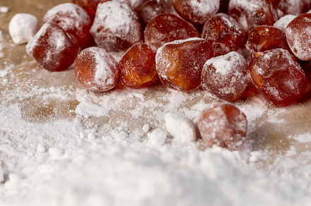 candied fruits of kumquat boiled in sugar syrup in powdered sugar, sweet dehydr
