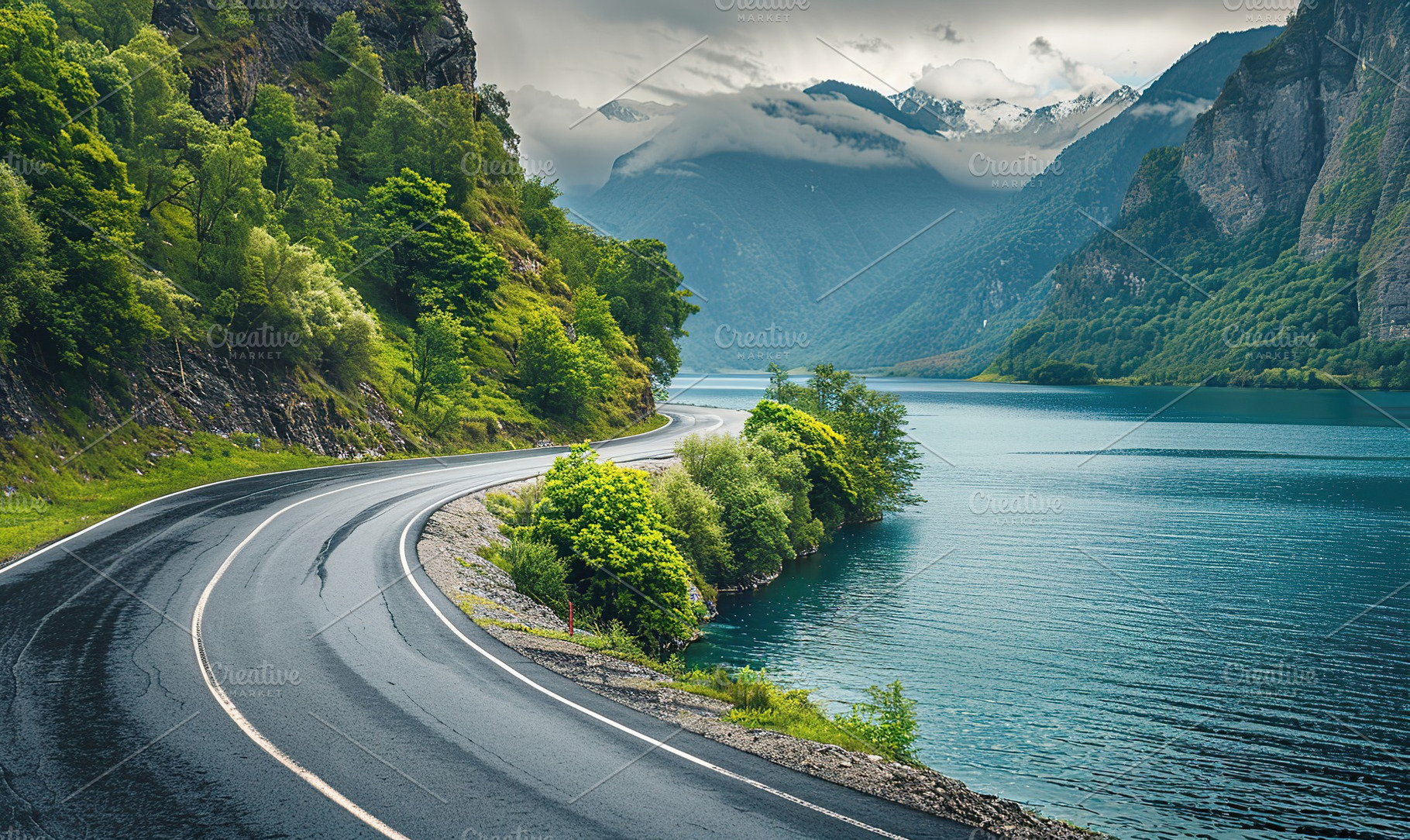 Beautiful landscape of winding asphalt road near the lake, an Abstract Photo by AlyaAnd