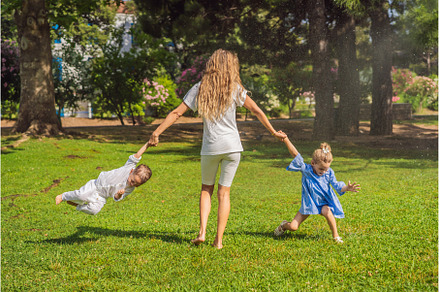 Happy family outdoors on the grass, a Person Photo by Elizaveta Galitskaya