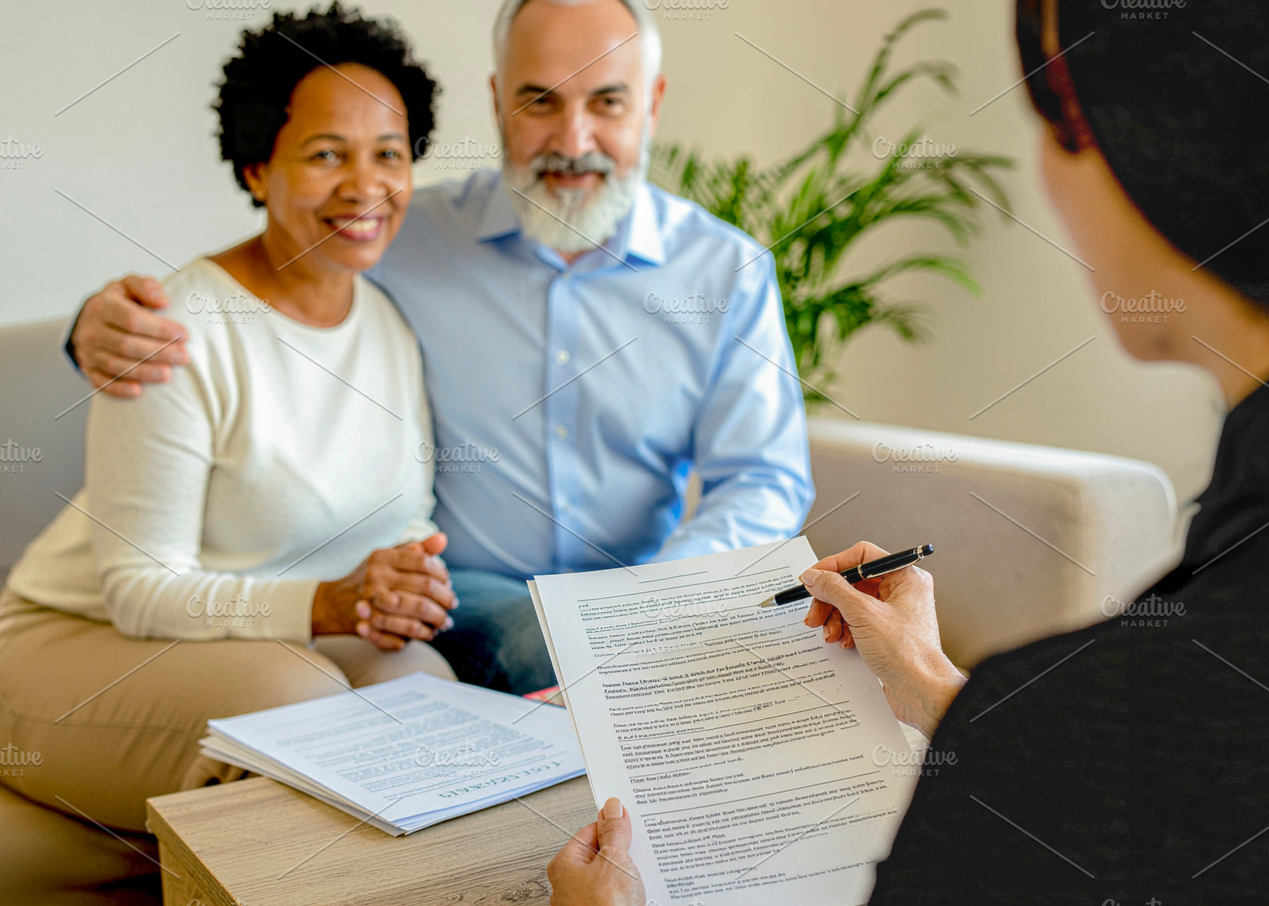 Financial consultation in living room setting, a Photo by DanFLCreativo
