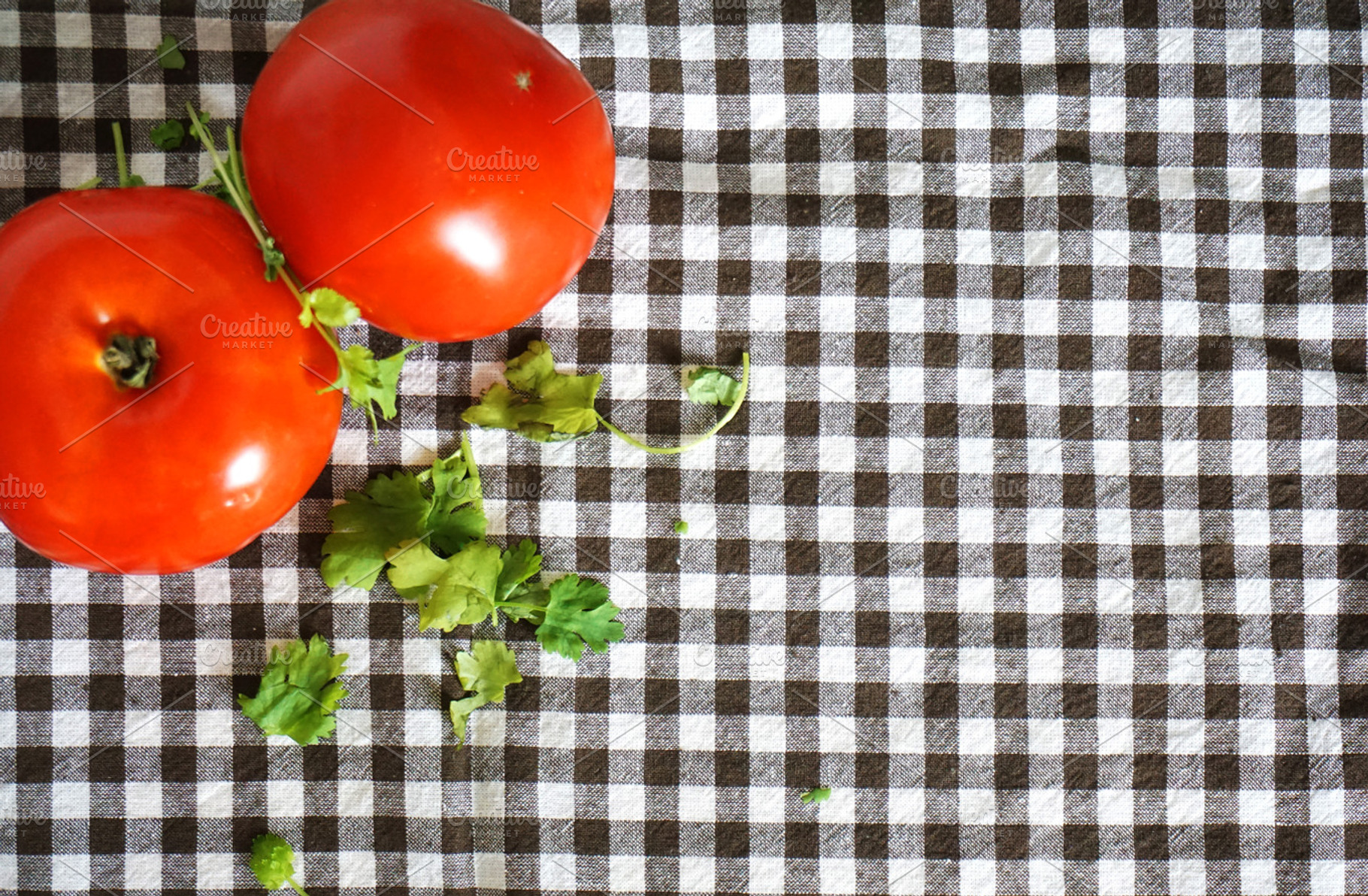 Tomatoes featuring tomato, coriander, and tablecloth