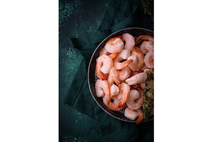 Frozen uncooked prawns or shrimps, a Food & Drink Photo by Yulia Furman