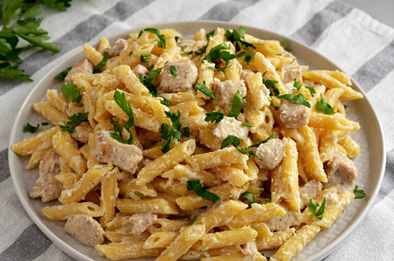 Homemade One-Pot Chicken Alfredo Pasta with Parsley on a Plate,, a Photo by LiudmylaChuhunova