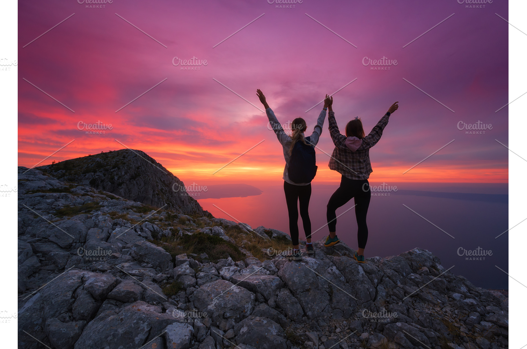Women with backpacks and raising, a Person Photo by den-belitsky