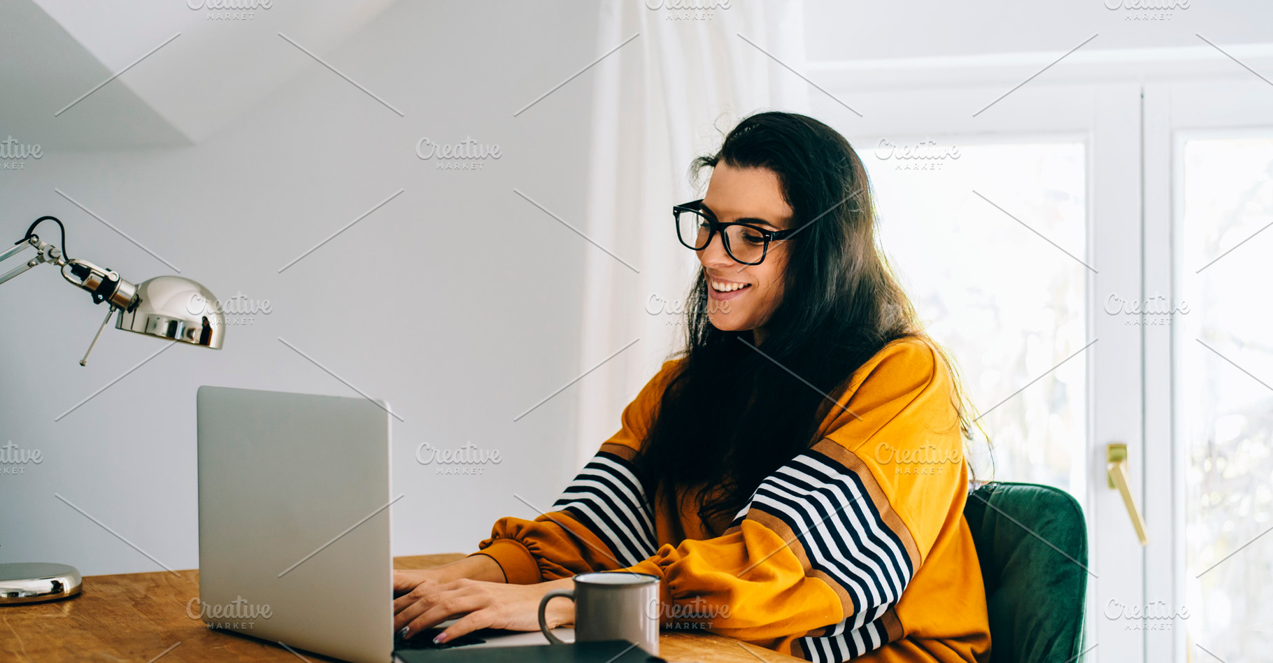 Smiling woman in her home office, a Person Photo by hitdelight