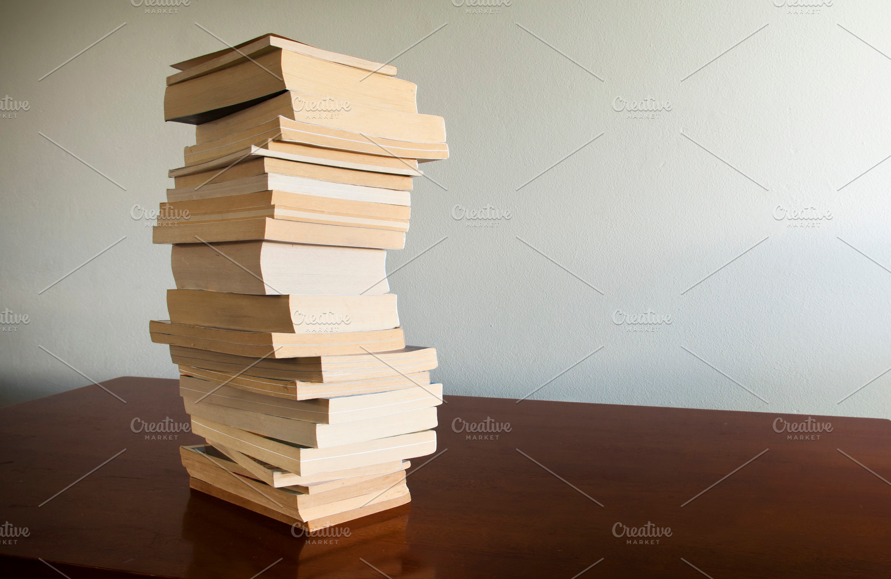 Book Stack on Table, a School & Education Photo by THP Creative