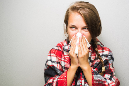 Sick woman wiping a nose featuring ill, sickness, and sick