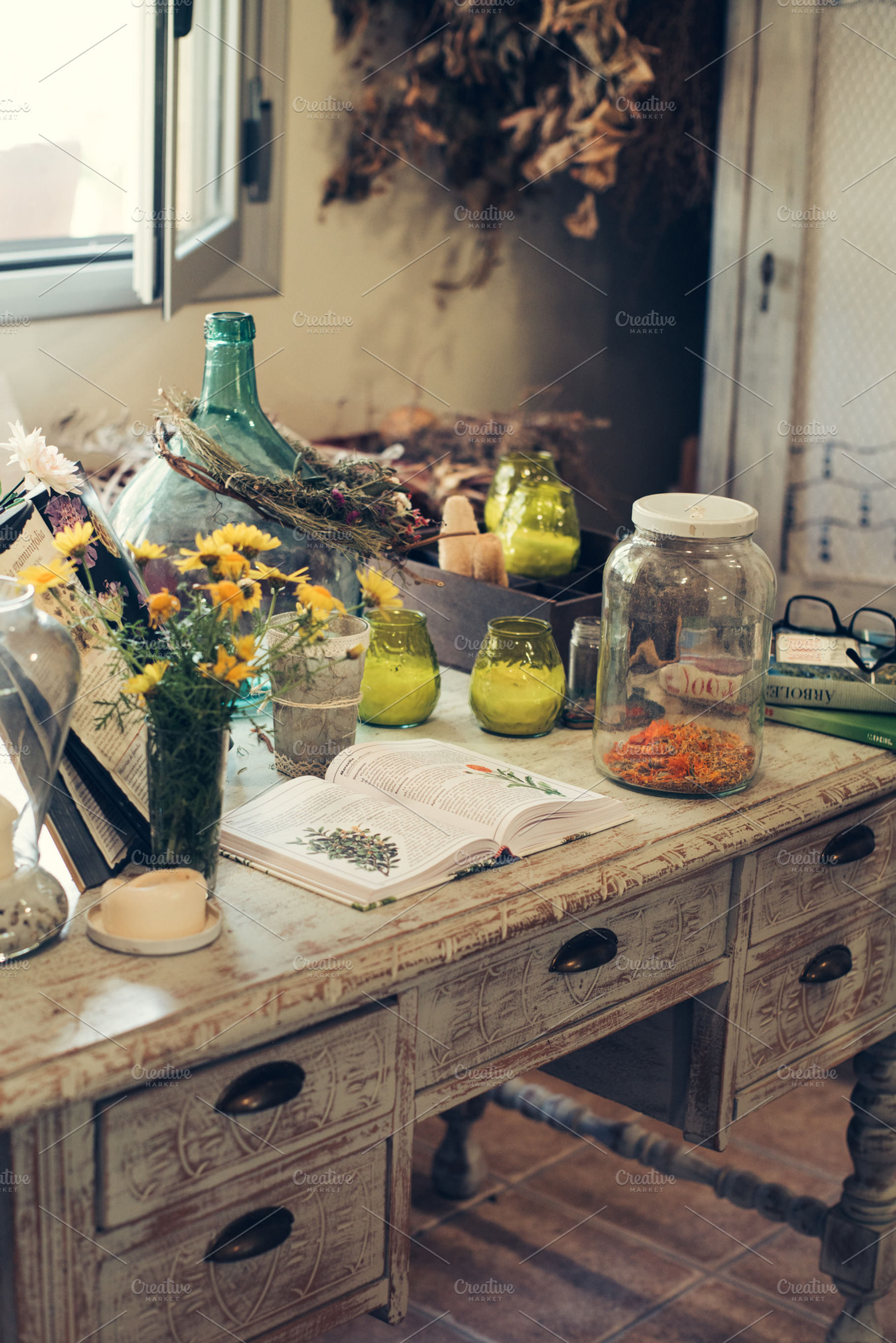Jars with plant infusions containing chamomile, honey, and lemon, a Health & Medical Photo by Ekaterina Tarasenko
