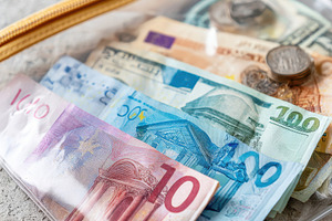 Cash in a clear ziplock bag, a Business Photo by AlyaAnd