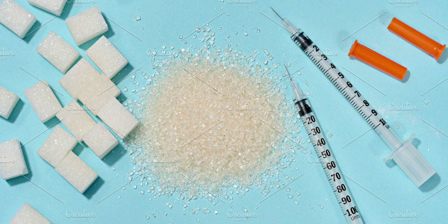 Different types of sugar and medical syringes on a blue backgrou, a Food & Drink Photo by ndanko