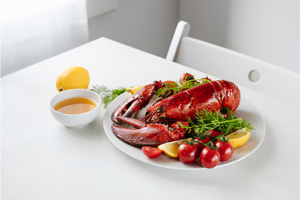 Whole freshly cooked lobster on, a Food & Drink Photo by Yummypic