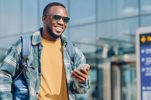 Smiling man in sunglasses checks, a Transportation Photo by MistyDay