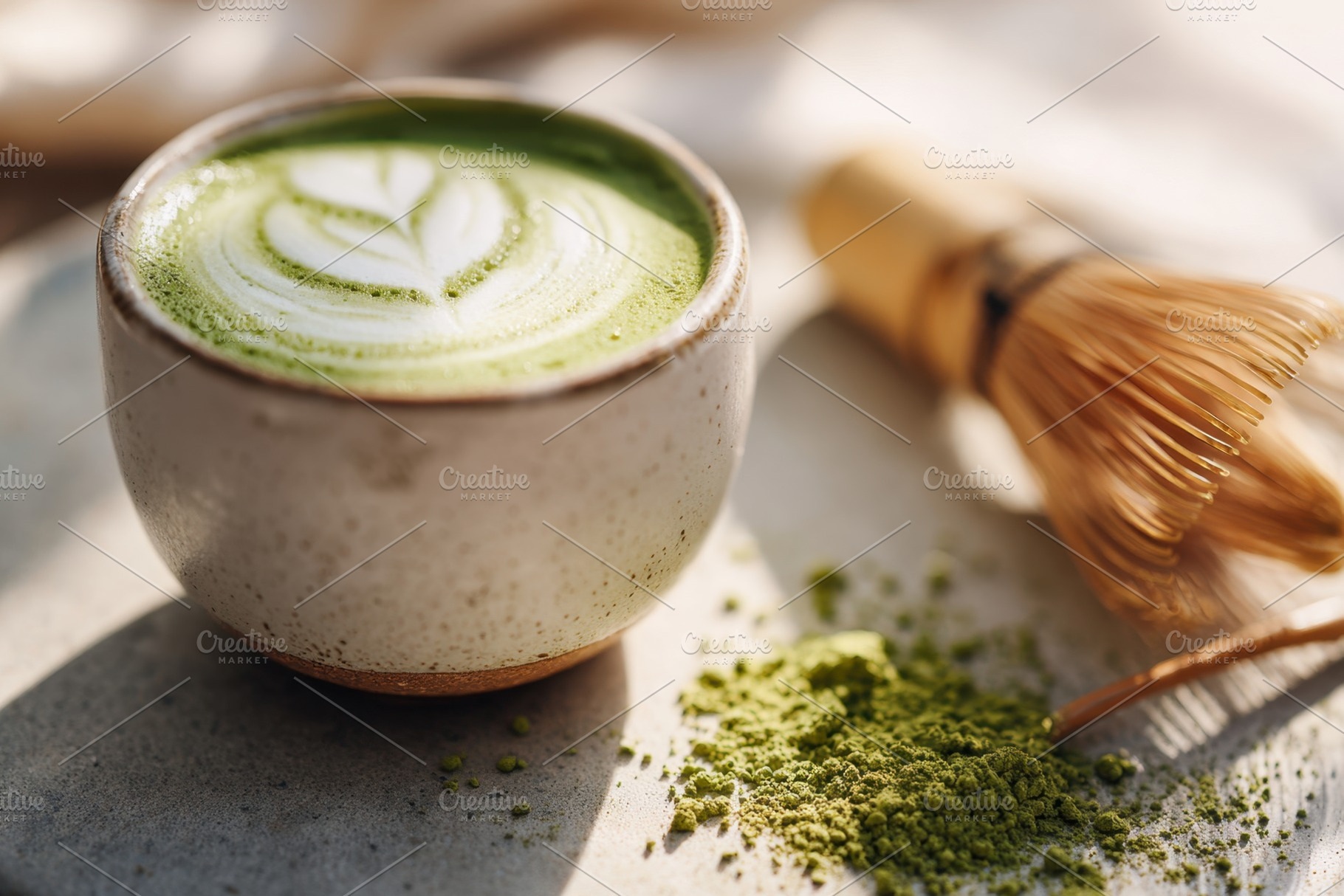 Matcha tea with latte art and bamboo whisk, a Food & Drink Photo by AlyaAnd