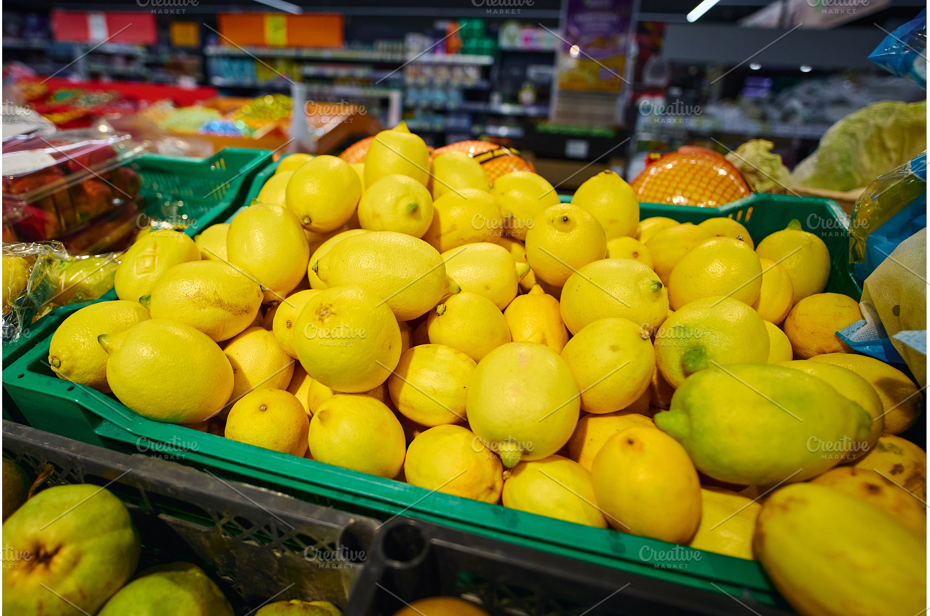 Lemons are piled high in a green, a Food & Drink Photo by darksoul72