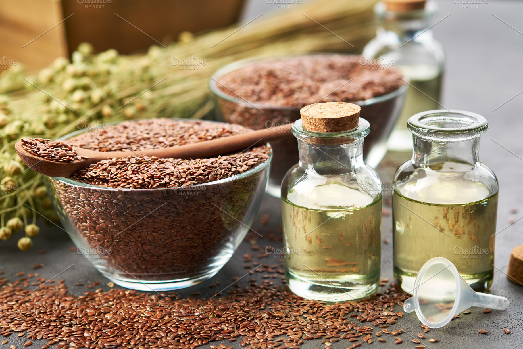 Linseed oil bottles, flax seeds bowl, a Food & Drink Photo by chamillewhite