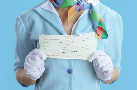 Closeup on female air hostess on blue, a Business Photo by Alliance Images