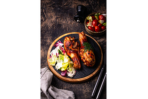 Roasted chicken drumstickswith, a Food & Drink Photo by Yulia Furman