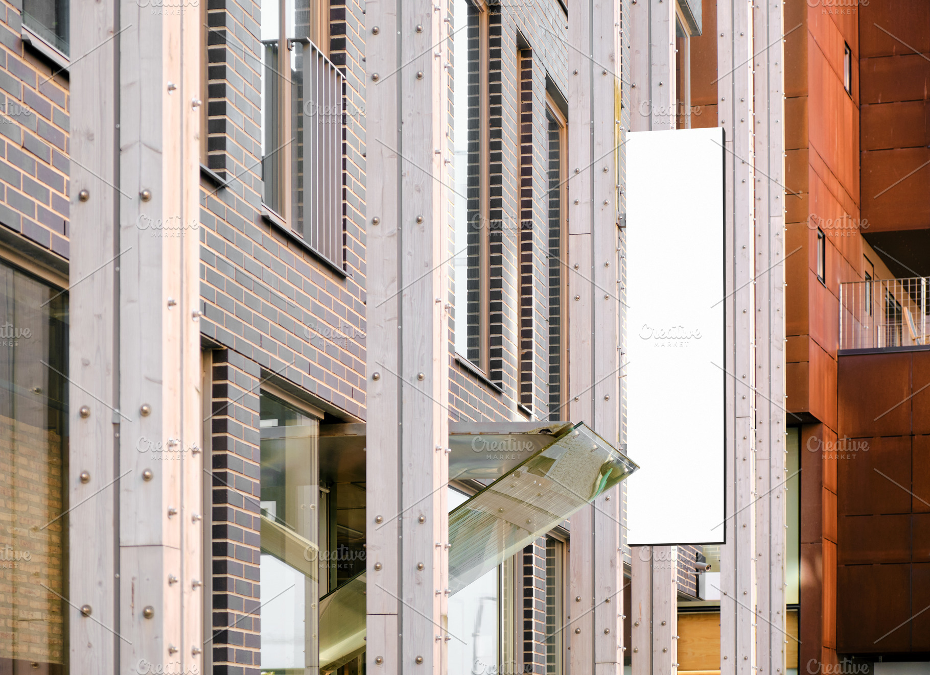 Shop signage on modern building wall, a Business Photo by BOOCYS