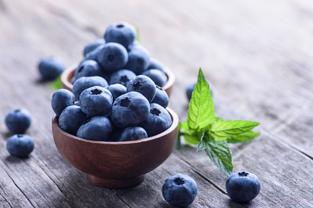 Blueberries in wooden bowl stock photo containing blueberries and fruit, a Food & Drink Photo by hitdelight
