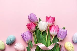 Colorful tulips and speckled eggs celebrating spring easter holi, a Holiday Photo by Olena Rudo