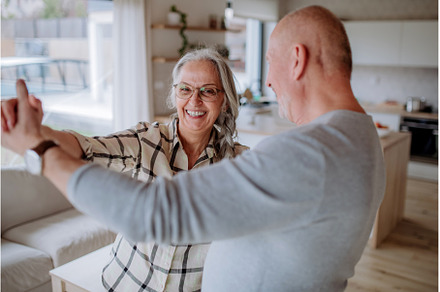 Cheerful senior couple dancing, a Person Photo by HalfPoint