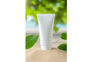 White cosmetic tube on sand with, a Beauty & Fashion Photo by Lermont51